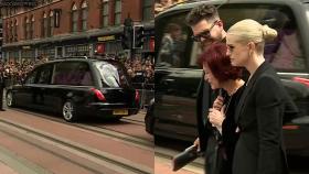 Ozzy Osbourne's family and fans mourn at his funeral in Birmingham